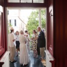 Guests mingle on the piazza during the party honoring Music in Time.